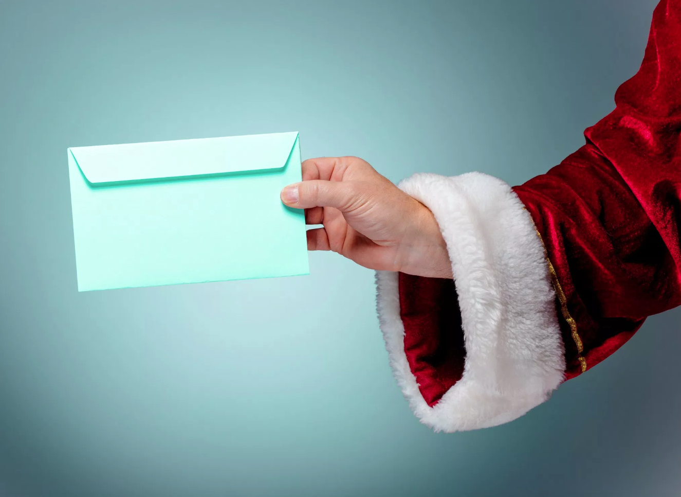 Santa Claus handing over a letter
